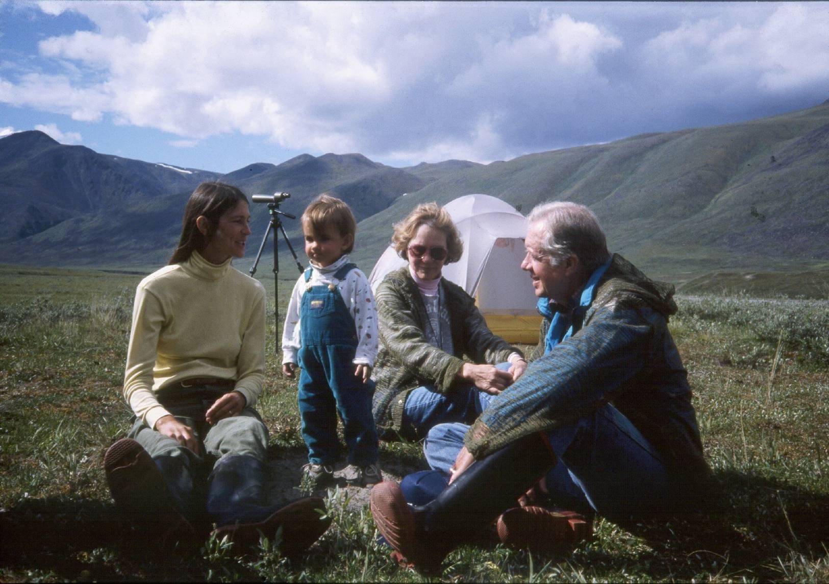 Caption: Debbie Miller of Alaska Wilderness League visits with the Carters on the tundra in the Arctic National Wildlife Refuge. Photo courtesy of Debbie S. Miller.